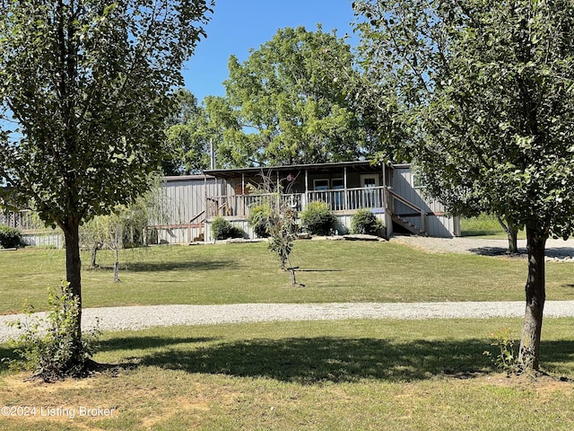 view of front of home with a front yard and a porch