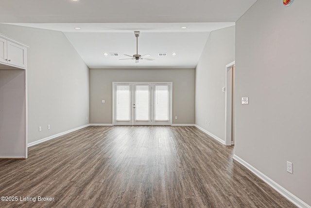 unfurnished room featuring ceiling fan, lofted ceiling, and dark hardwood / wood-style floors