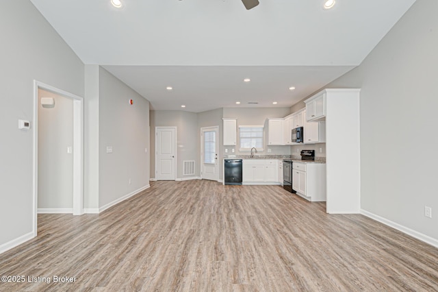 unfurnished living room with light hardwood / wood-style floors and ceiling fan