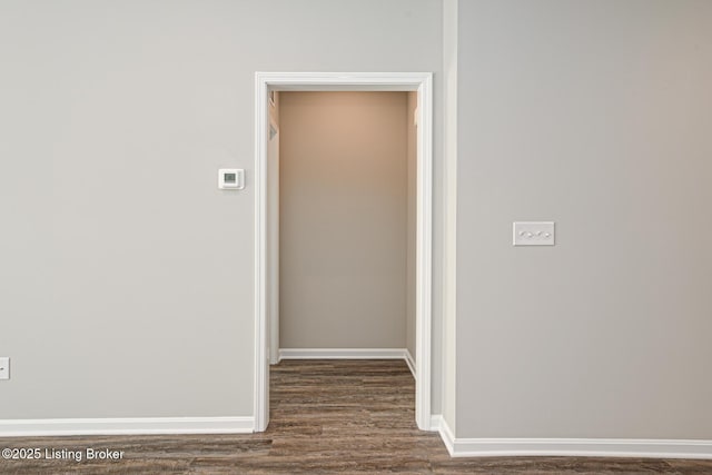 corridor with dark wood-type flooring