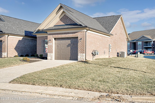 view of front of home with central AC unit, a garage, and a front lawn