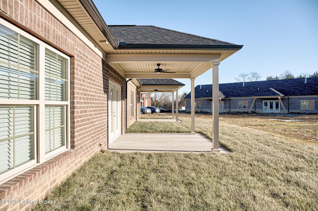 view of yard with a patio area and ceiling fan