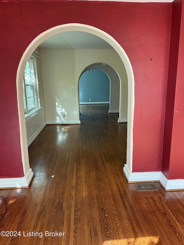 interior space with dark hardwood / wood-style floors