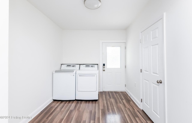 laundry area featuring washing machine and dryer and dark hardwood / wood-style flooring