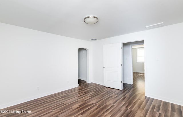 unfurnished room featuring dark hardwood / wood-style floors