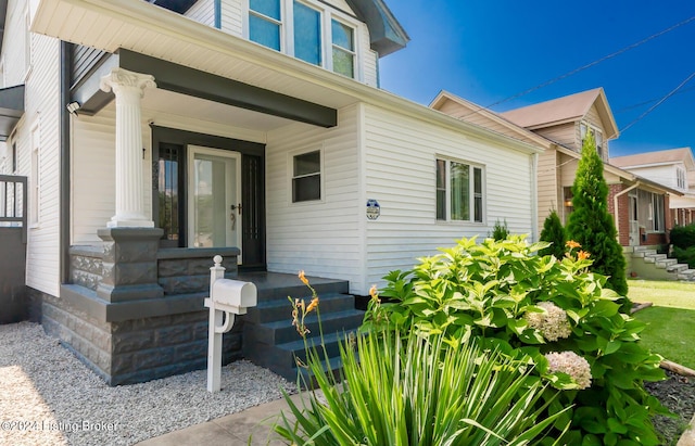 doorway to property featuring covered porch