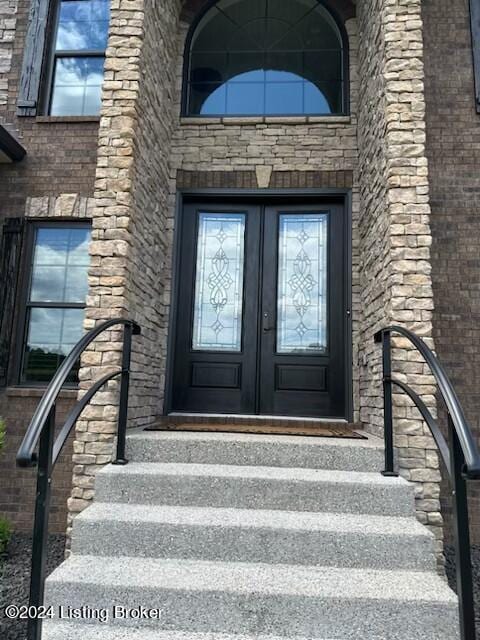 entrance to property featuring french doors