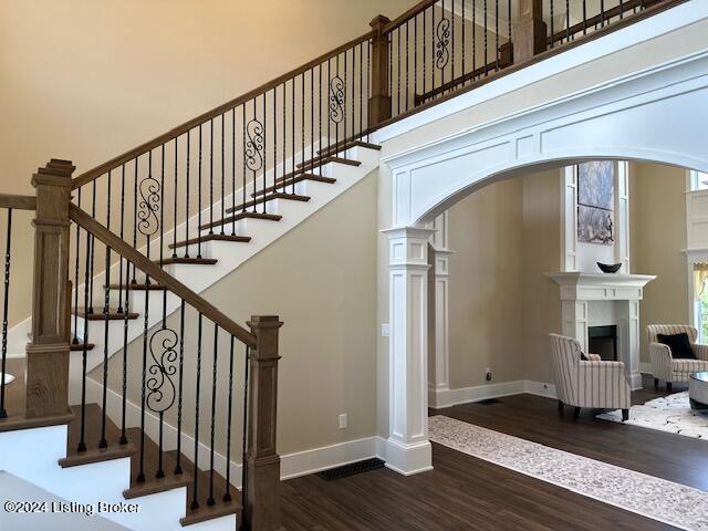 staircase with wood-type flooring