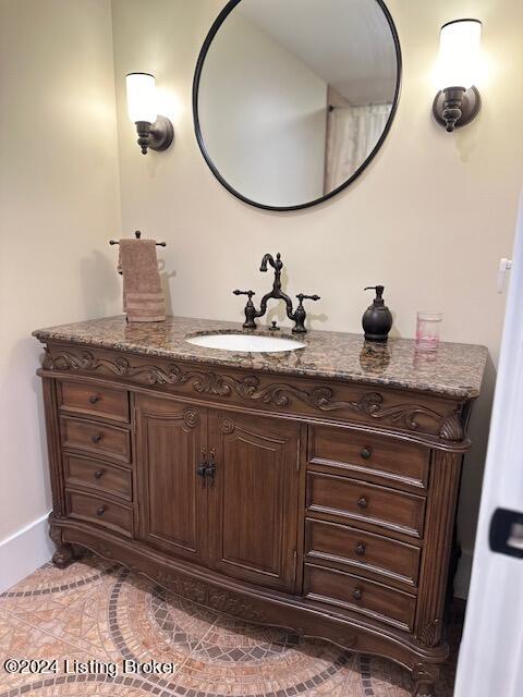 bathroom with tile patterned floors and vanity