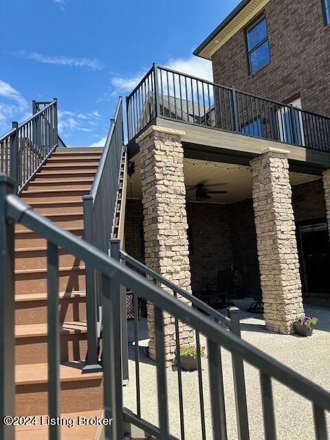 view of side of home featuring a balcony