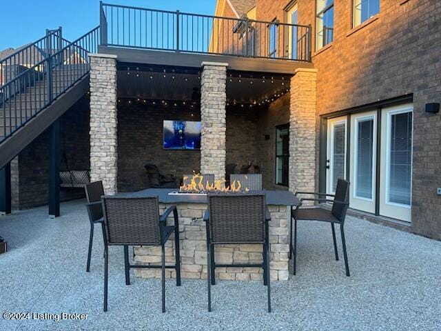 view of patio / terrace with a fire pit