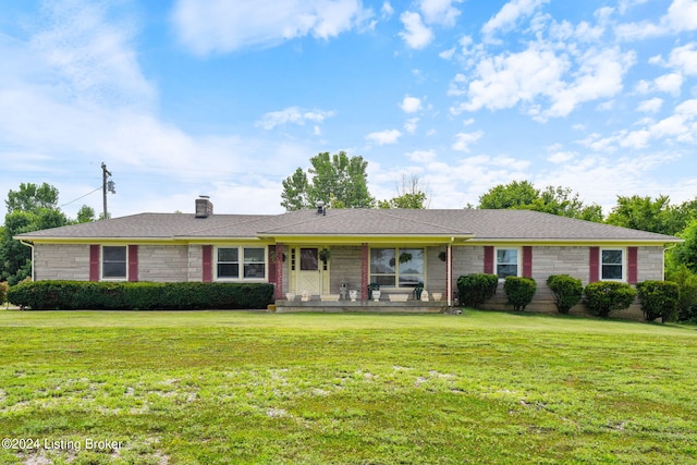 ranch-style home with a front lawn