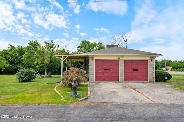 garage with a lawn