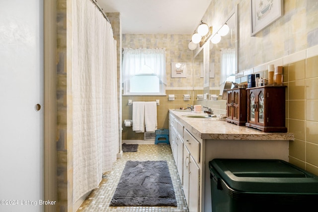 bathroom featuring vanity, tile walls, and tile patterned floors