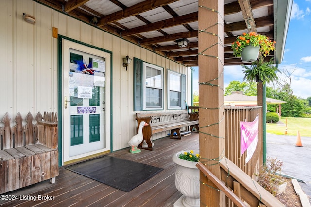 wooden terrace featuring a porch