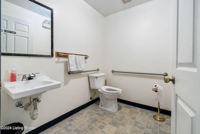 bathroom featuring toilet