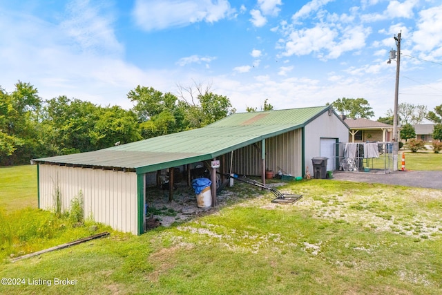 view of outbuilding with a yard