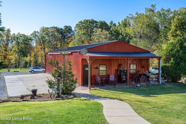 view of outbuilding with a lawn