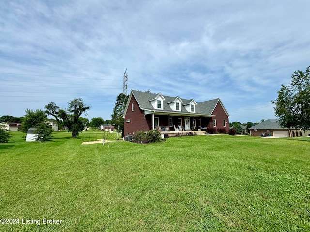 cape cod home featuring a front lawn