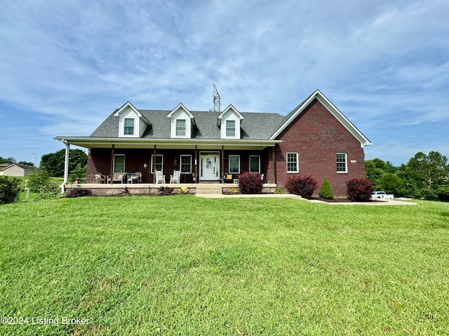 view of front of house with a front lawn and covered porch