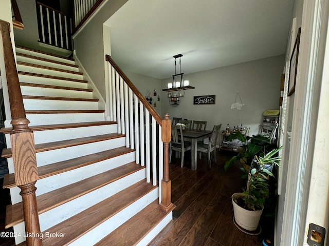 stairway with hardwood / wood-style flooring