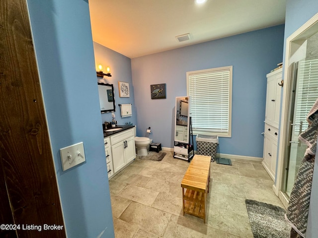 bathroom with tile patterned floors, toilet, and vanity