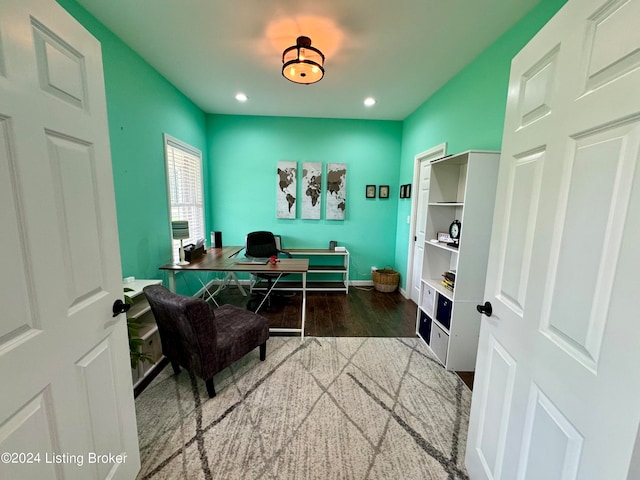 home office with wood-type flooring