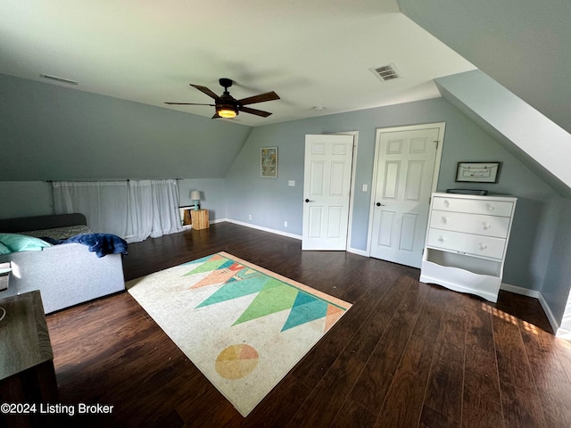 bedroom featuring ceiling fan, hardwood / wood-style flooring, and vaulted ceiling