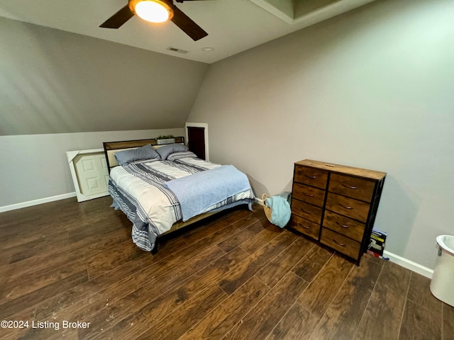 bedroom featuring ceiling fan, vaulted ceiling, and dark wood-type flooring