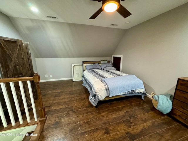 bedroom with ceiling fan, dark hardwood / wood-style flooring, and lofted ceiling