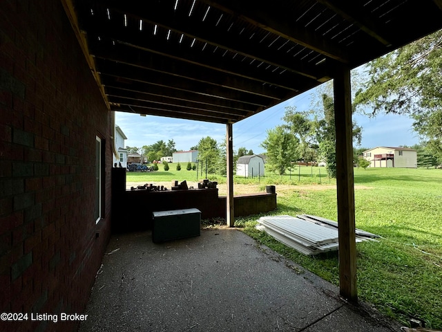 view of patio with a storage unit