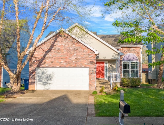 view of front of home featuring a garage and a front lawn