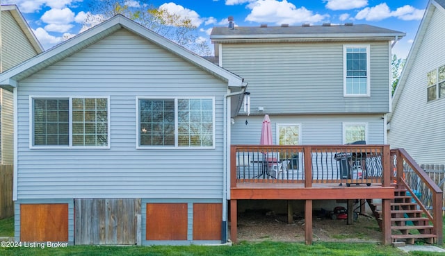 back of house featuring a deck