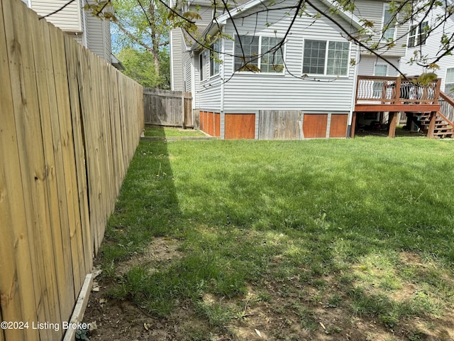 view of yard with a wooden deck