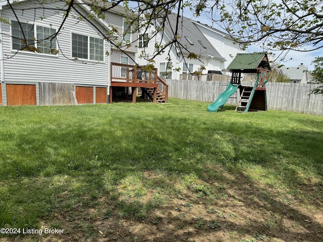 view of yard with a playground and a deck