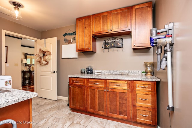 kitchen with washer / clothes dryer