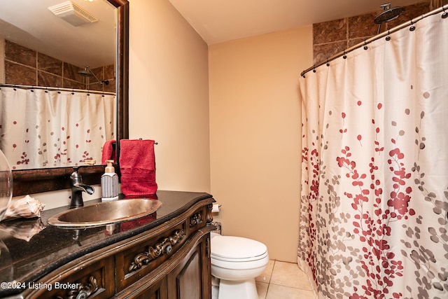 bathroom with vanity, toilet, tile patterned floors, and a shower with curtain