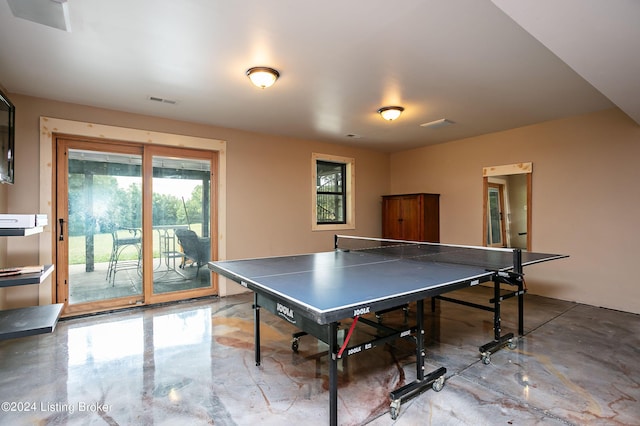 game room featuring concrete flooring