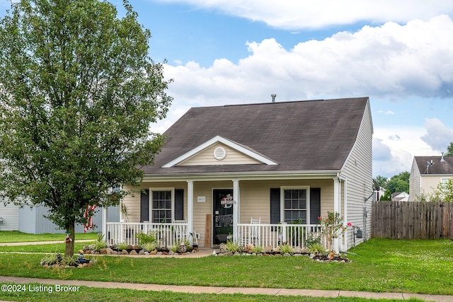 view of front of house featuring covered porch and a front lawn