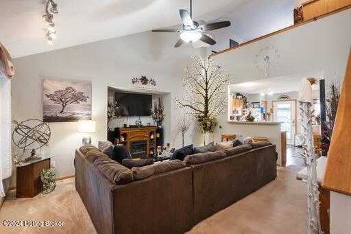 living room featuring lofted ceiling and ceiling fan