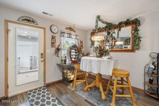 dining room with dark hardwood / wood-style floors