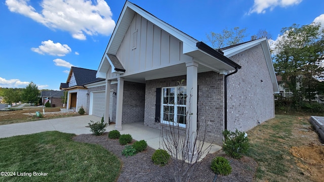 view of property exterior featuring a lawn and a garage