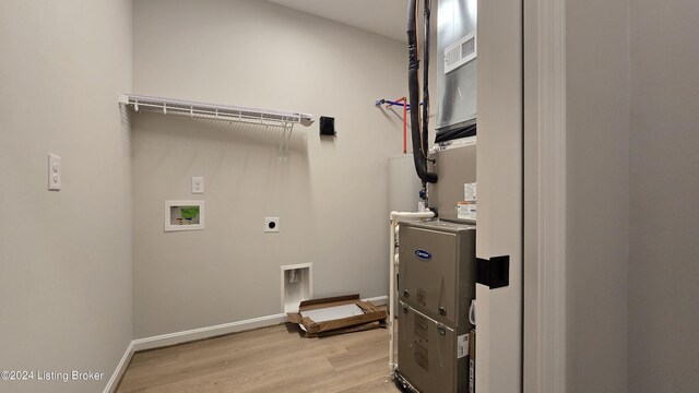 laundry room featuring light hardwood / wood-style floors, hookup for a washing machine, and hookup for an electric dryer