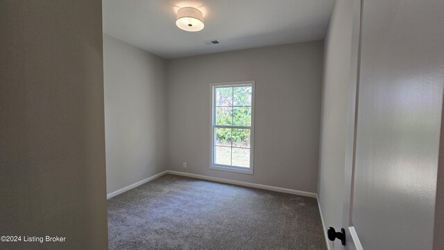 empty room with carpet flooring