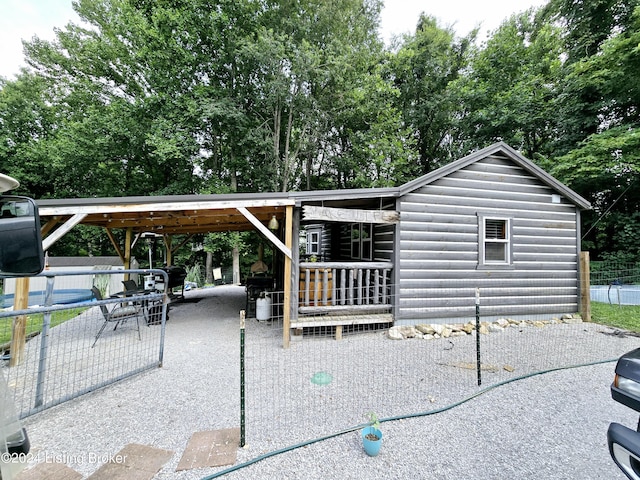 exterior space with log veneer siding