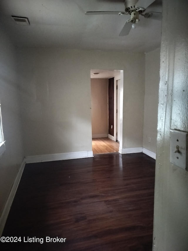 unfurnished room with hardwood / wood-style floors and ceiling fan