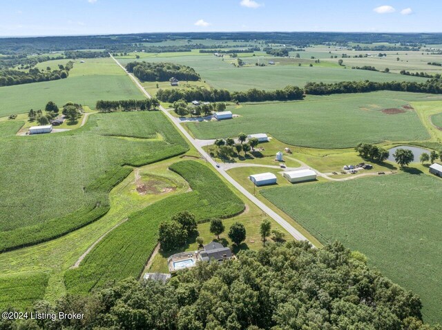 birds eye view of property with a rural view