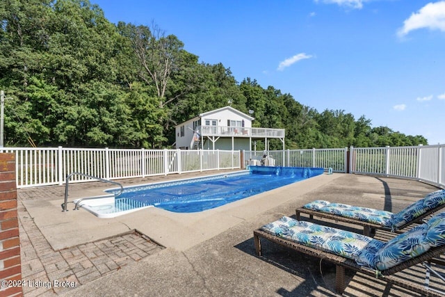 view of pool featuring a patio