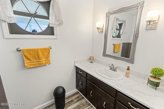 bathroom with vanity and hardwood / wood-style flooring