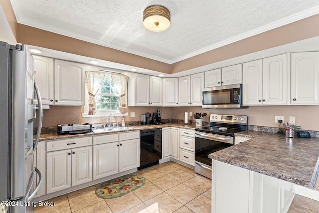 kitchen featuring appliances with stainless steel finishes, white cabinets, and sink